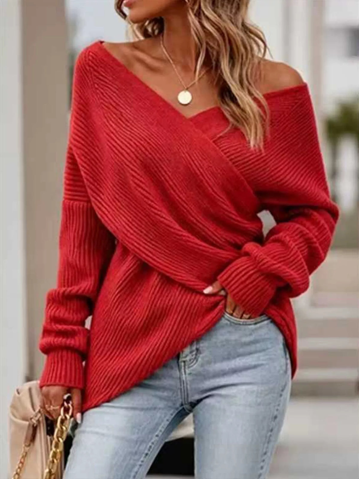 Crisscross ribbed knit long sleeve sweater by Trendsi, featuring a stylish design and cozy texture in a close-up view.
