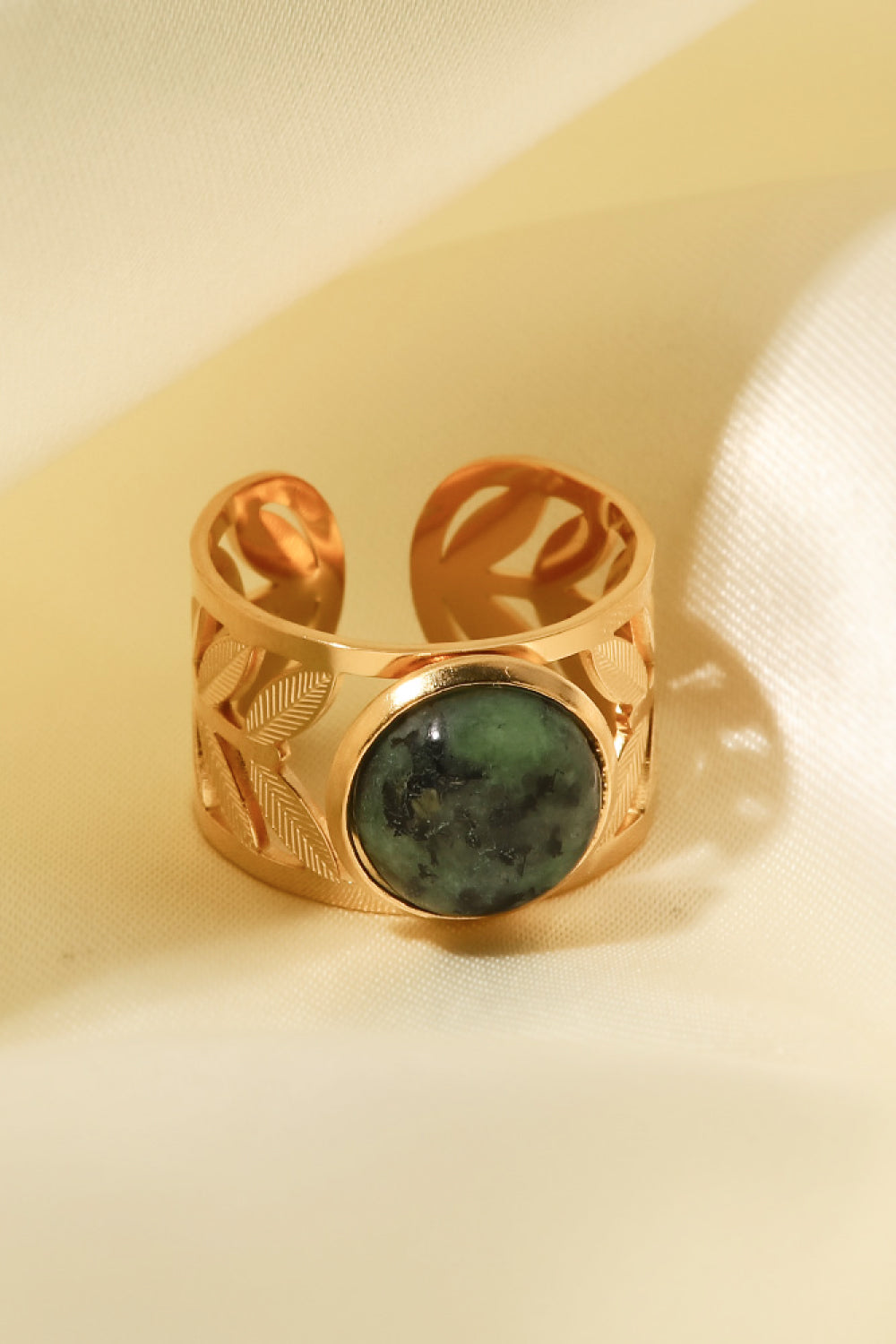 18k gold plated malachite leaf ring with intricate leaf design, showcasing vibrant green malachite gemstone on a gold band