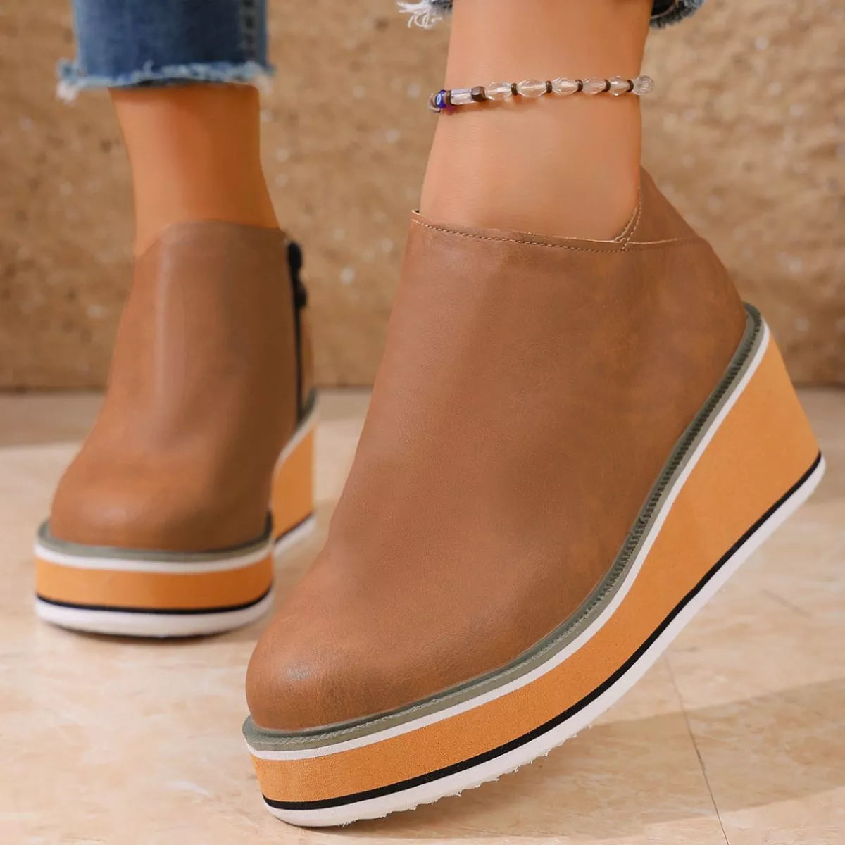 Women's round toe wedge ankle boots by Trendsi, showcasing a stylish design with a chunky heel and ankle height, on a neutral background.