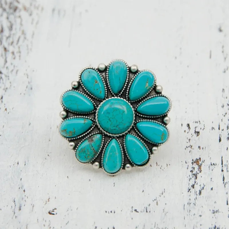 Artificial turquoise alloy flower ring with intricate floral design, showcasing vibrant turquoise stones and silver-tone alloy band.