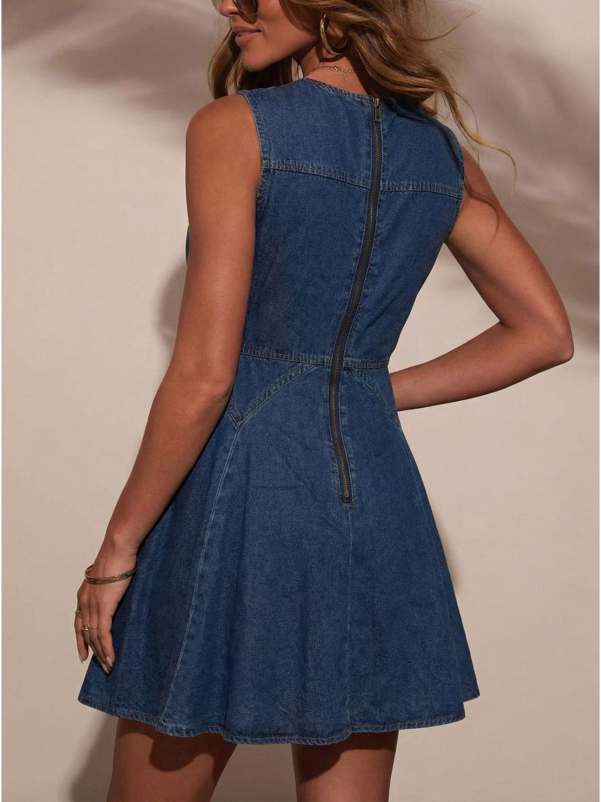 Women's sleeveless denim mini dress by Plush Fashion Hub with button front and stretchy cotton blend fabric.