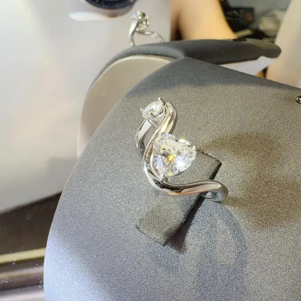 Irregular shape 1.3 carat moissanite ring in sterling silver, showcasing a unique gemstone design in a stylish rings photo.