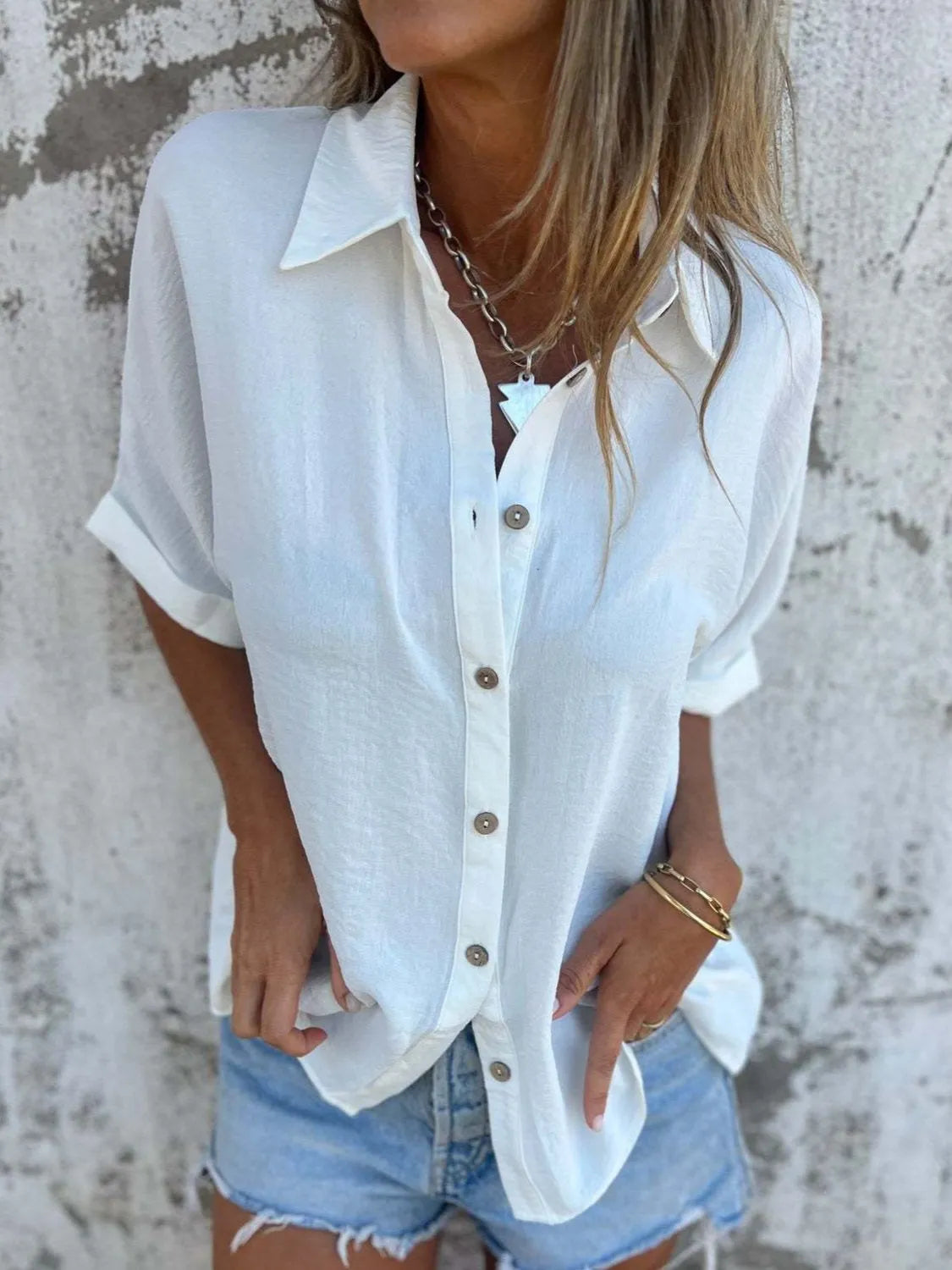 Women's half sleeve collared button-down office blouse by Plush Fashion Hub, shown in a stylish and professional top.