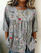 Women's floral 3D print pullover top in loose fit, casualwear from Plush Fashion Hub, featuring colorful floral patterns and a relaxed style.