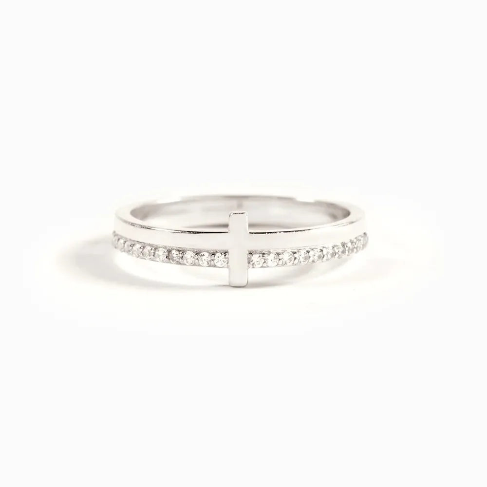 Sterling silver cross ring from Plush Fashion Hub featuring a detailed cross design on a sleek band.