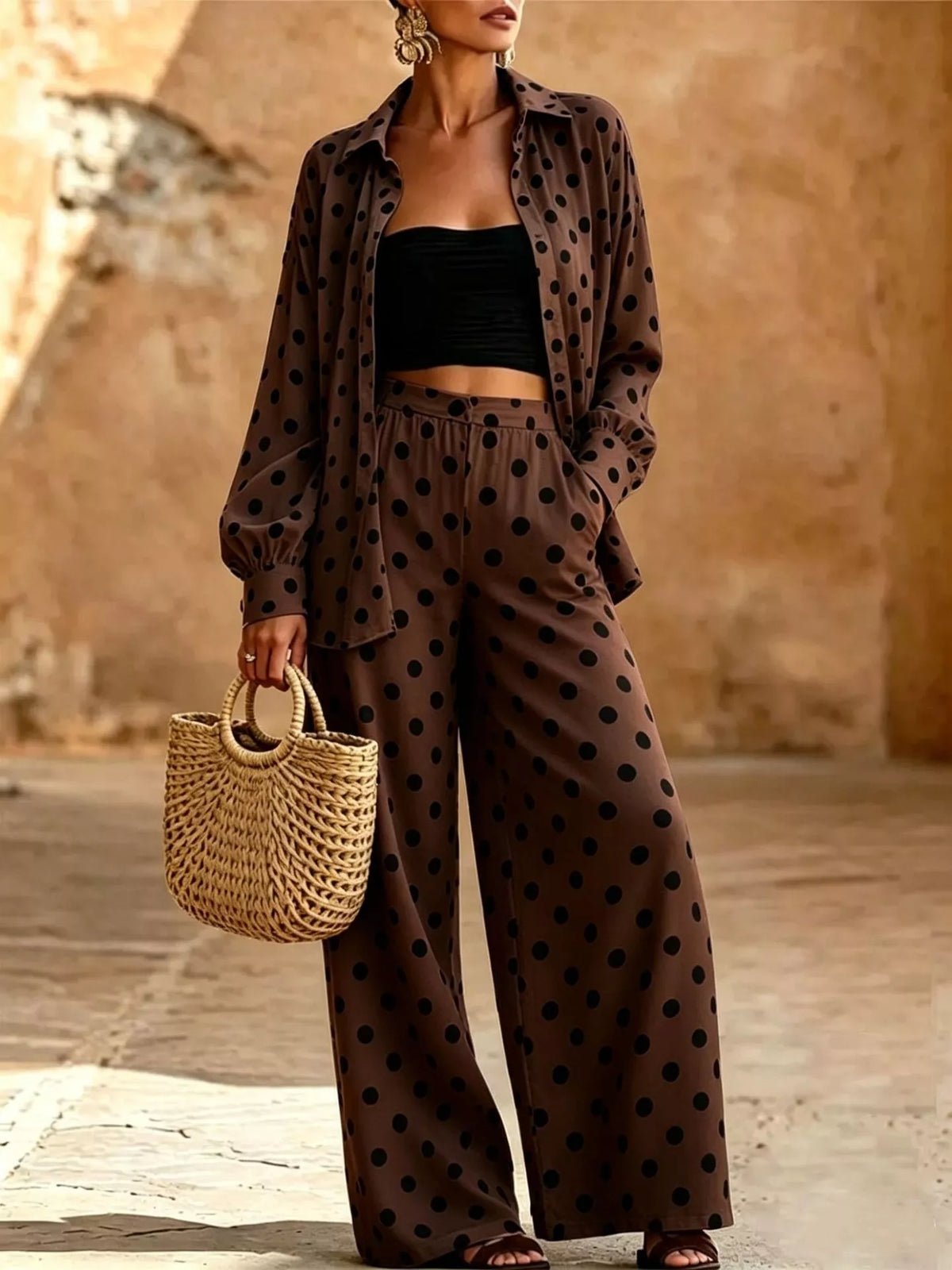 Plus size polka dot shirt and wide-leg pants set by Trendsi, featuring a stylish matching top and flowy bottoms.