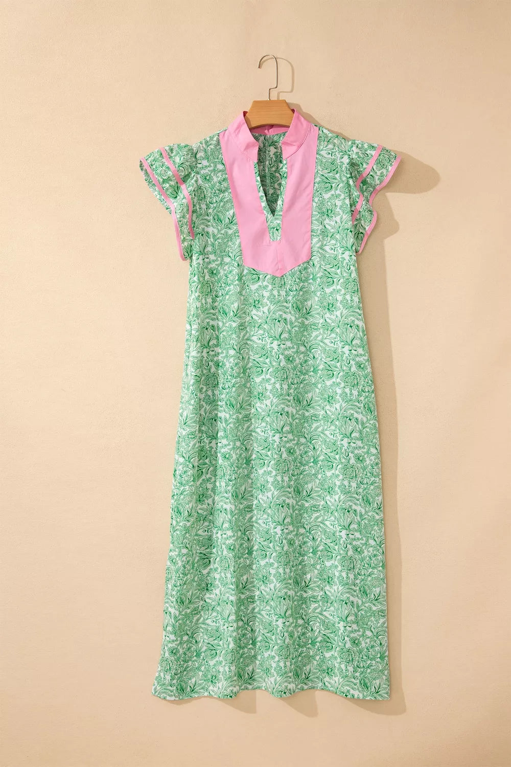 Floral midi dress with contrast trim and flutter sleeves from Trendsi, featuring a flowy silhouette and vibrant floral pattern.
