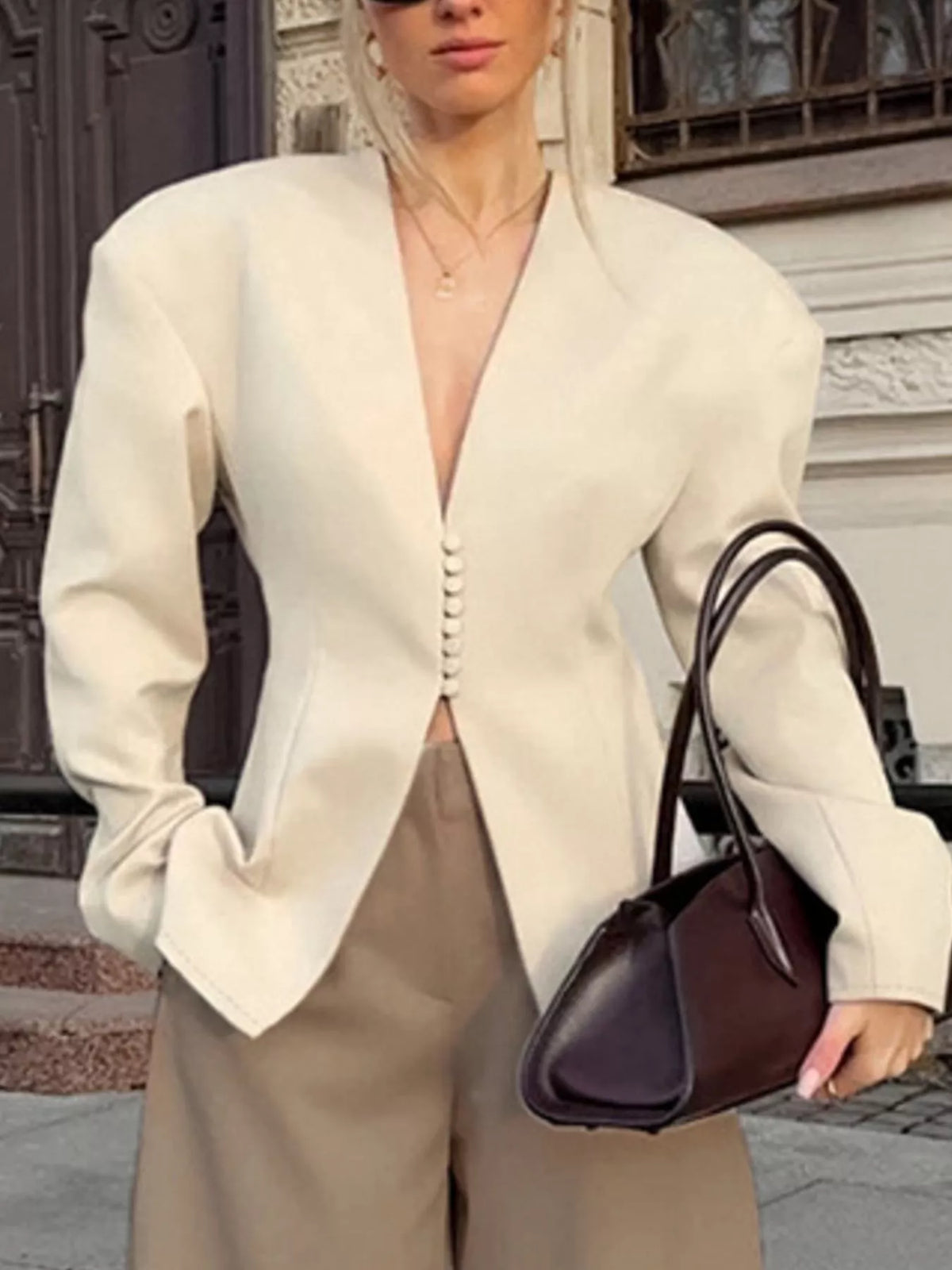 Trendsi women's V-neck button-up blazer with structured shoulders, tailored fit, and classic design, shown on a model.