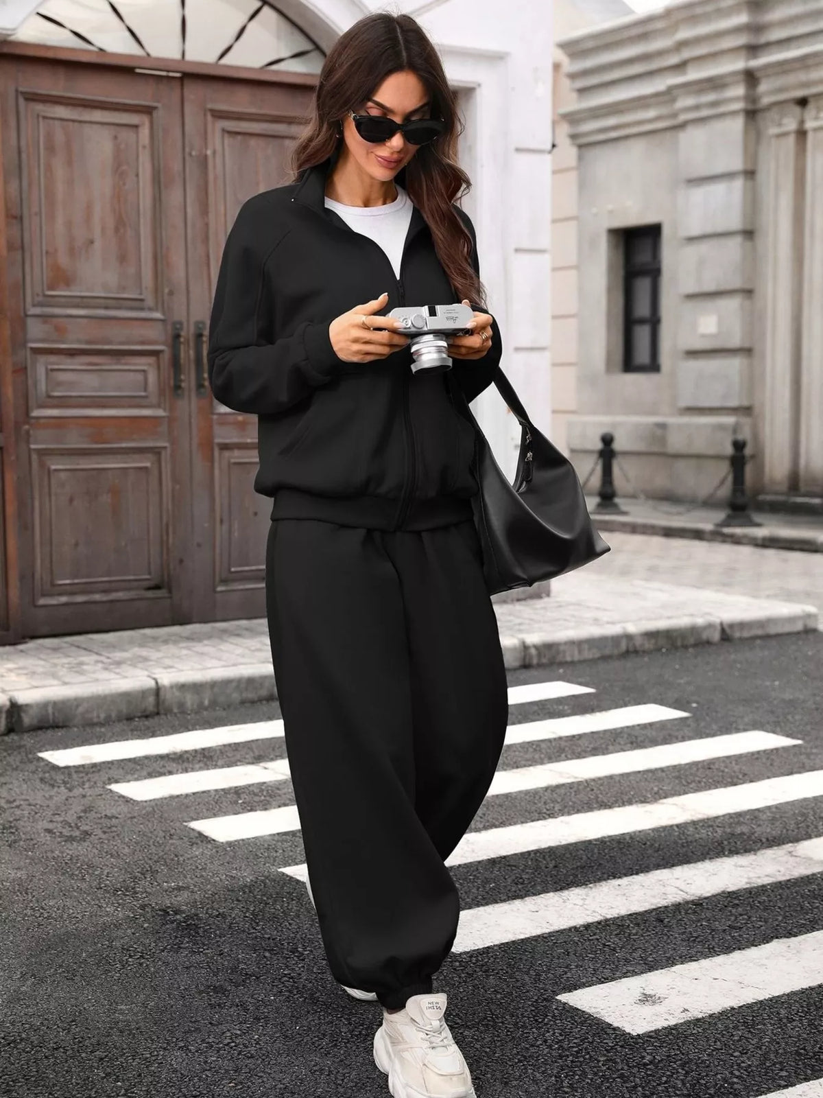 Women's zip-up long sleeve top and pants set by Trendsi, comfortable casual loungewear in coordinating fabric and style.
