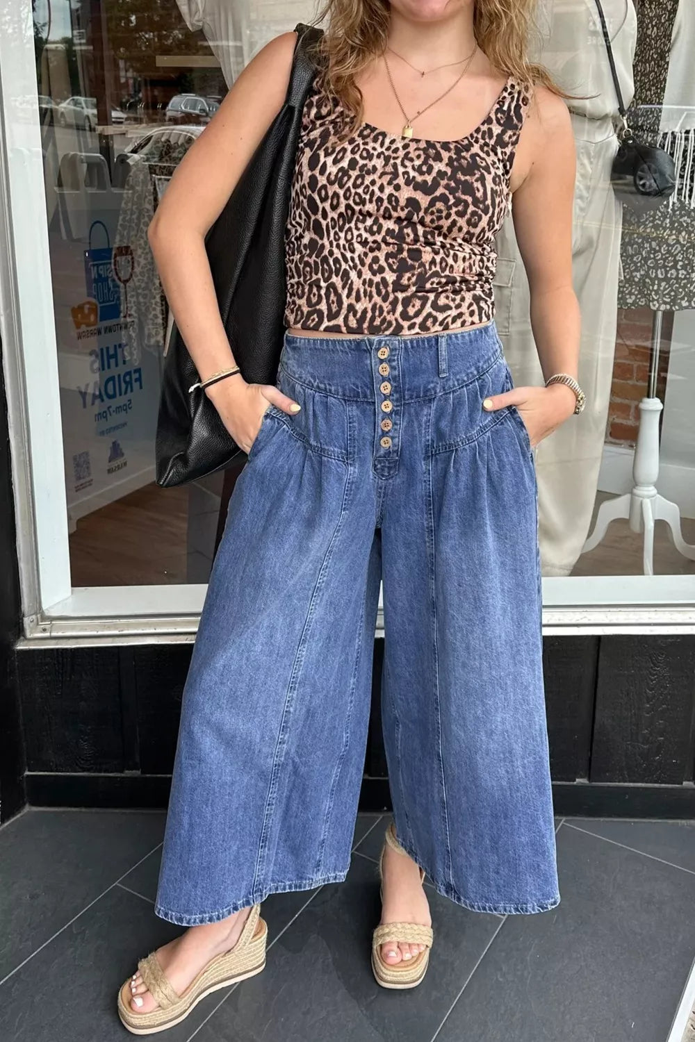 High-waisted wide-leg cotton denim jeans with button fly, classic fit, by Trendsi, shown in a front view.