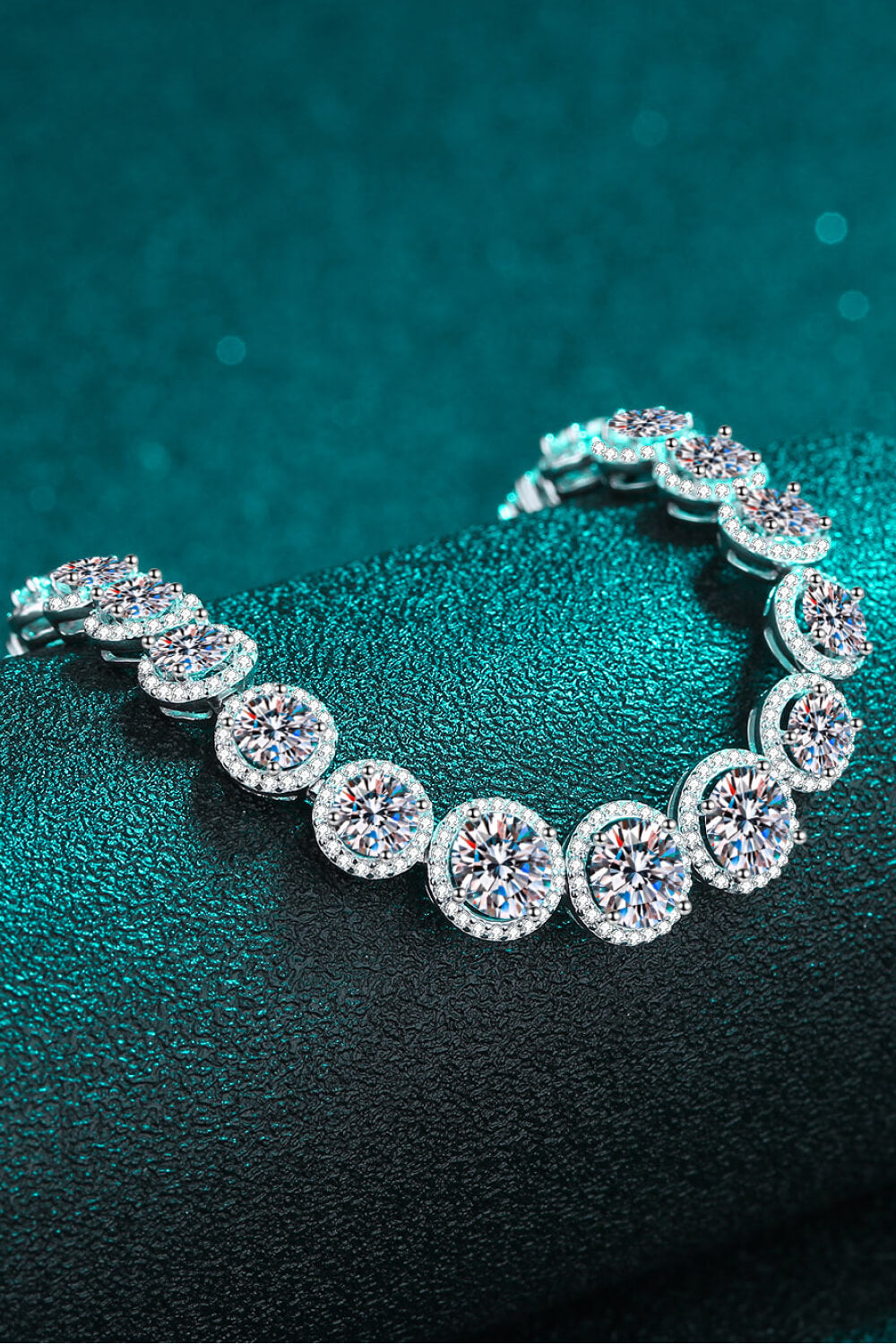 Sterling silver bracelet featuring a 10.4 carat moissanite gemstone, elegant jewelry piece with sparkling stones and intricate design.