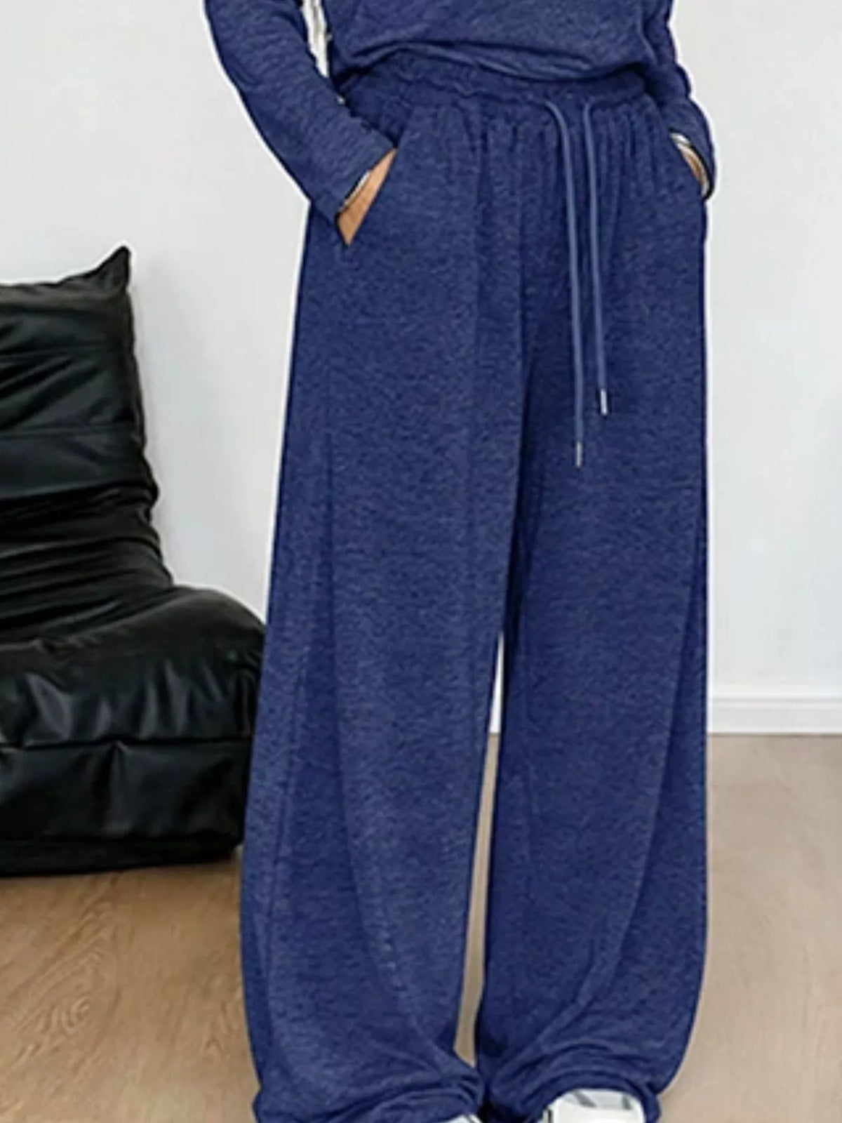 Plus size loose fit one-shoulder T-shirt and pants set from Trendsi, featuring a casual, comfortable matching two-piece outfit.