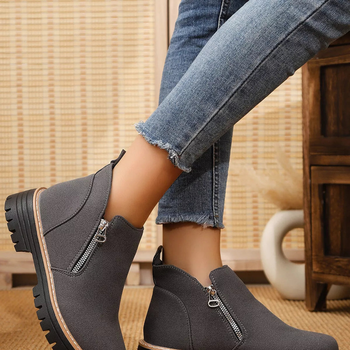 Trendsi ankle boots with zipper accents featuring a sleek leather finish and stylish design, perfect for casual or dressy outfits.
