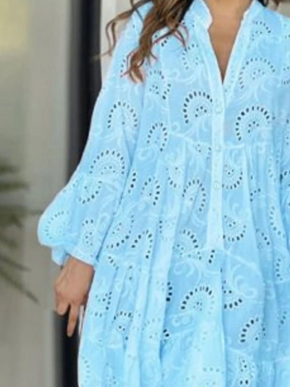 Plus size full-length dress with eyelet fabric, ruffled hem, and tiered design from Trendsi, featuring a stylish and flowy silhouette.