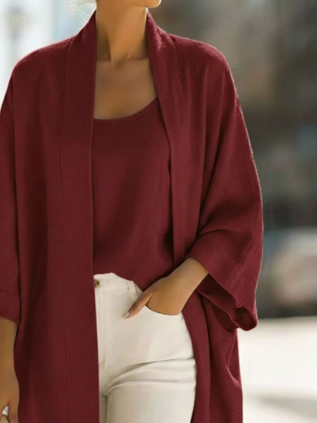 Plus size open-front cardigan and matching tank top set by Trendsi, featuring a cozy, stylish layered look.