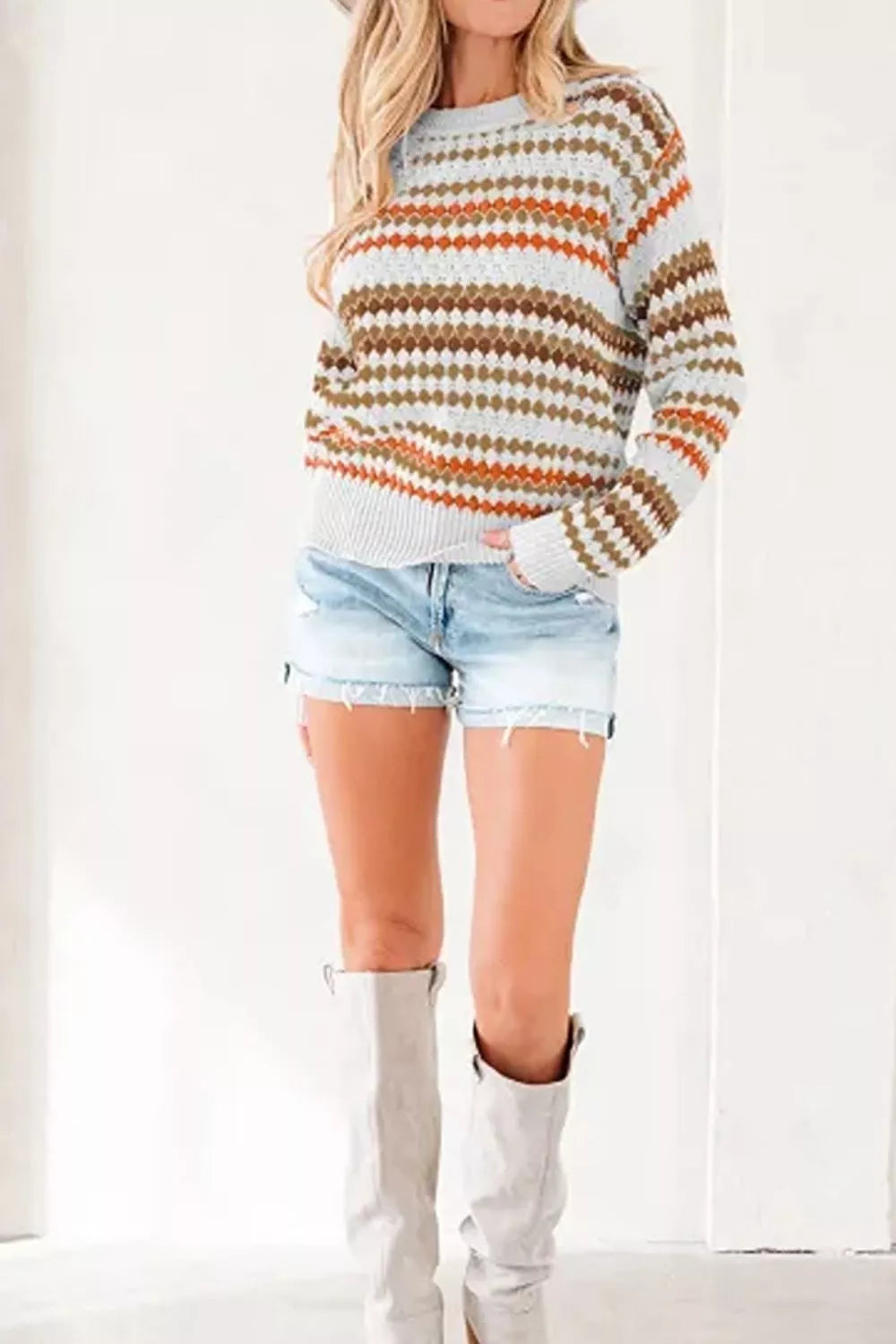 Women's striped geometric pattern sweater from Trendsi, featuring a stylish design with bold stripes and a cozy fit.