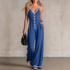 Women's FitiqueFit V-neck backless wide-leg jumpsuit with high waist, casual style, shown on a model in a relaxed pose.