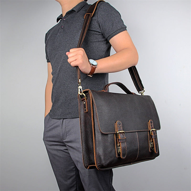 Men's retro casual leather business briefcase by Pi-Mart with sturdy handles and classic design, suitable for professional use.