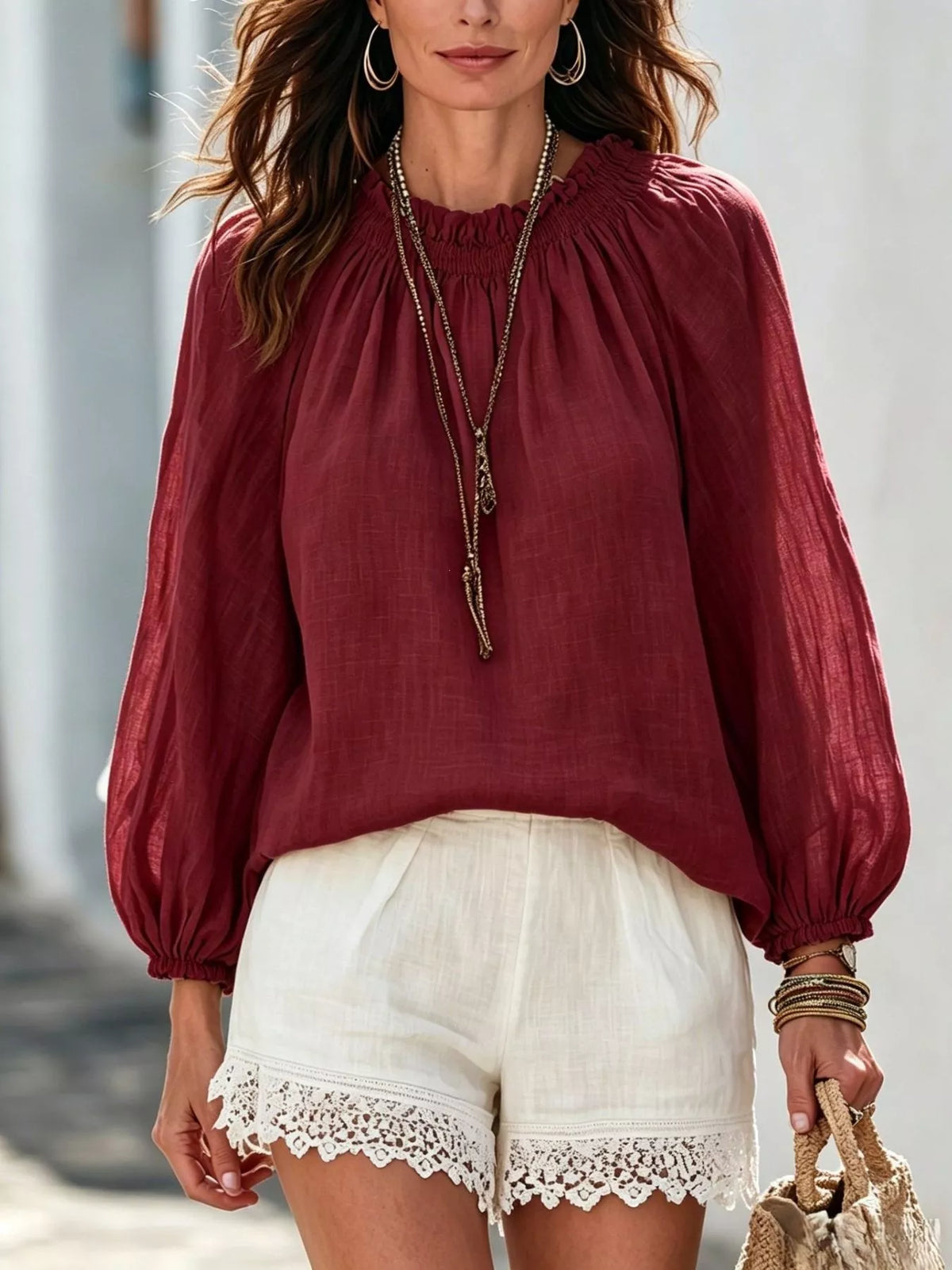 Women’s round neck balloon sleeve blouse by Trendsi, featuring a stylish fit and soft fabric, shown in a close-up view.