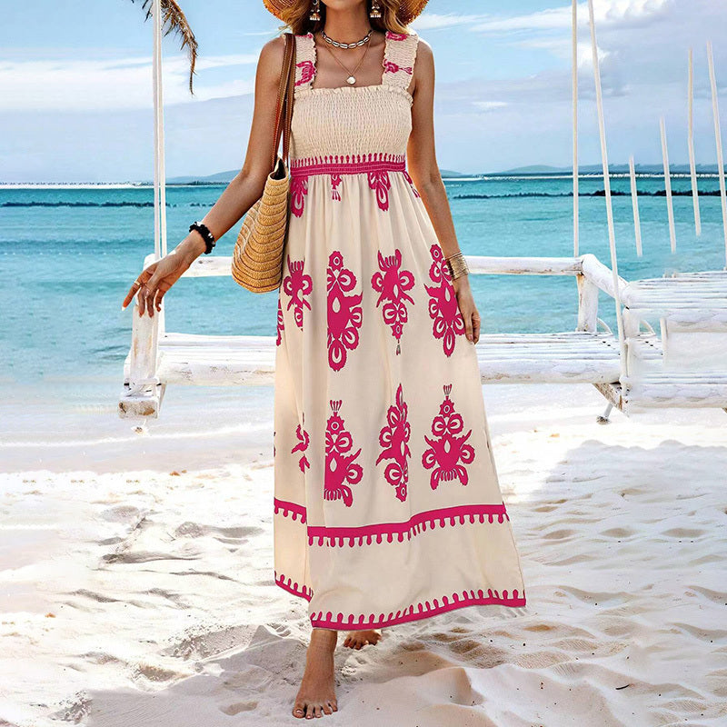 Women’s wide-strap printed maxi dress by FitiqueFit, casualwear style with vibrant floral patterns and flowing fabric.