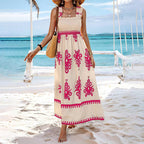 Women’s wide-strap printed maxi dress by FitiqueFit, casualwear style with vibrant floral patterns and flowing fabric.