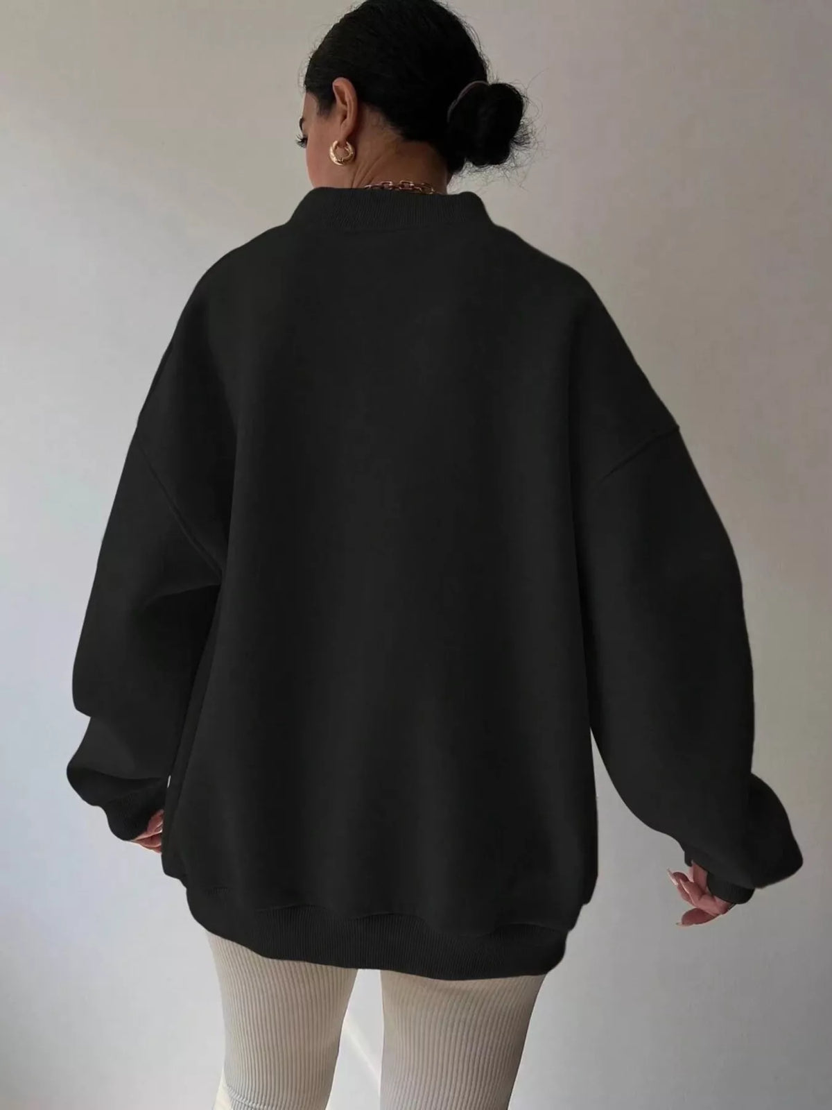 Oversized dropped shoulder long sleeve sweatshirt in soft fabric, featuring a relaxed fit and trendy style from Trendsi.