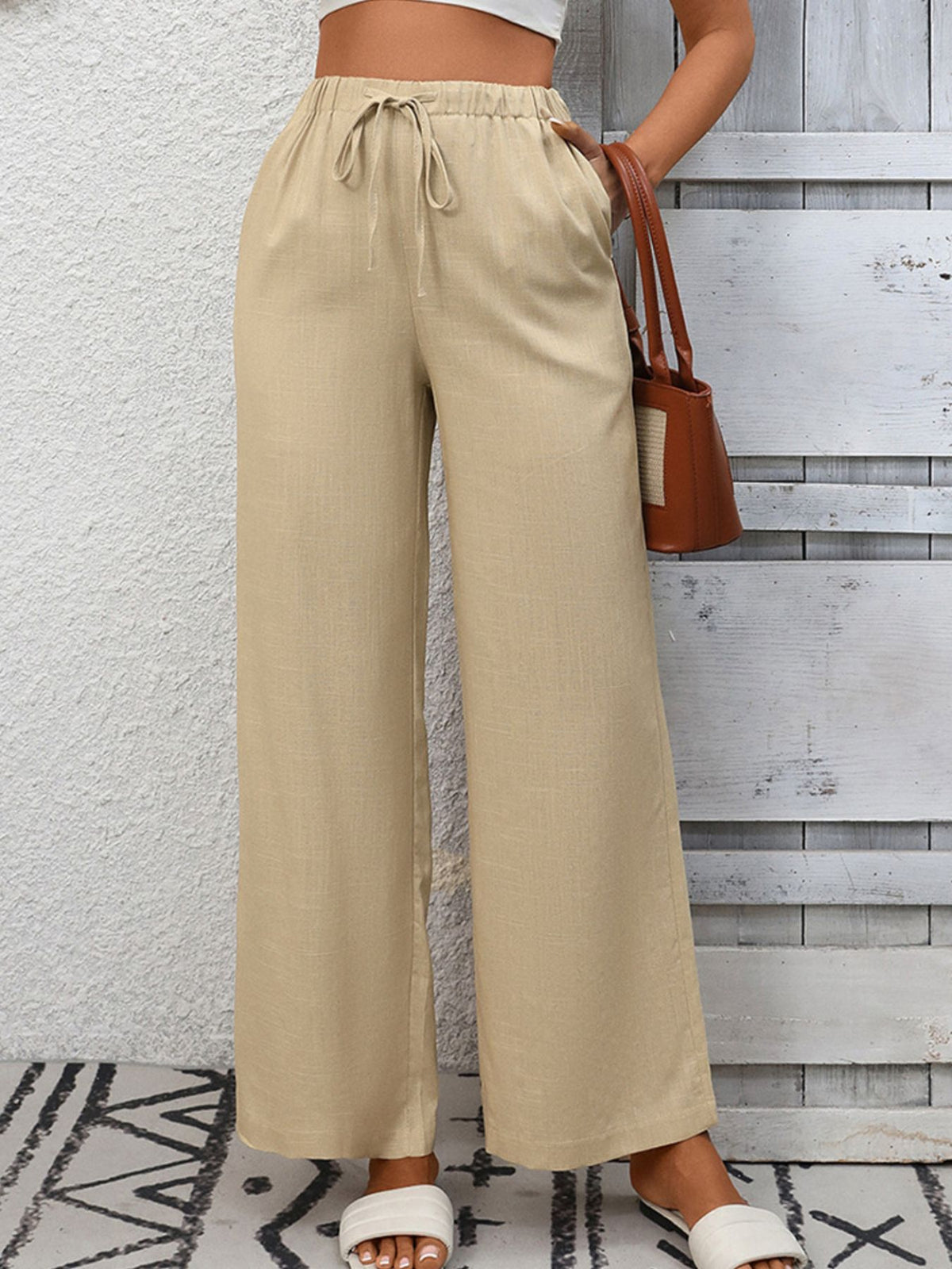 Women's high-waisted wide-leg drawstring pants in soft breathable viscose by Plush Fashion Hub, shown in a relaxed fit.