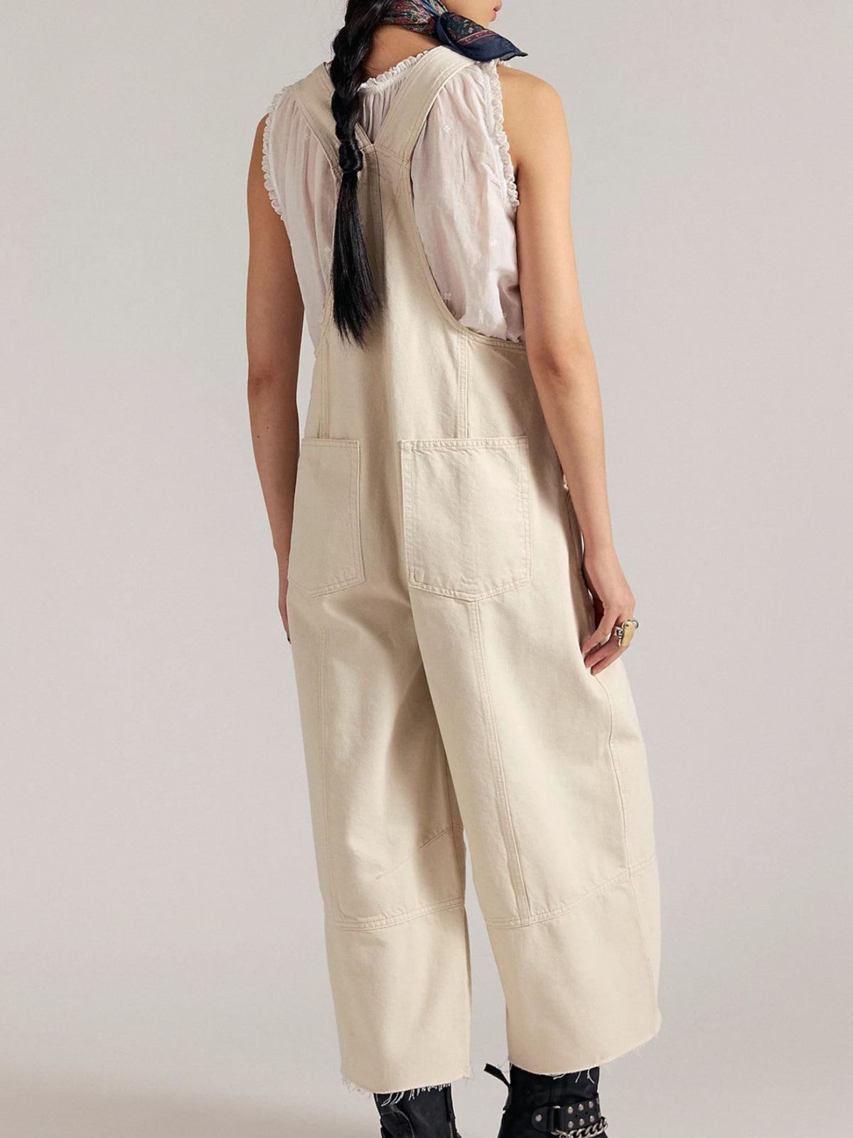 Lightweight casual denim jumpsuit with raw hem wide-leg style from Plush Fashion Hub, featuring adjustable straps and front pockets.