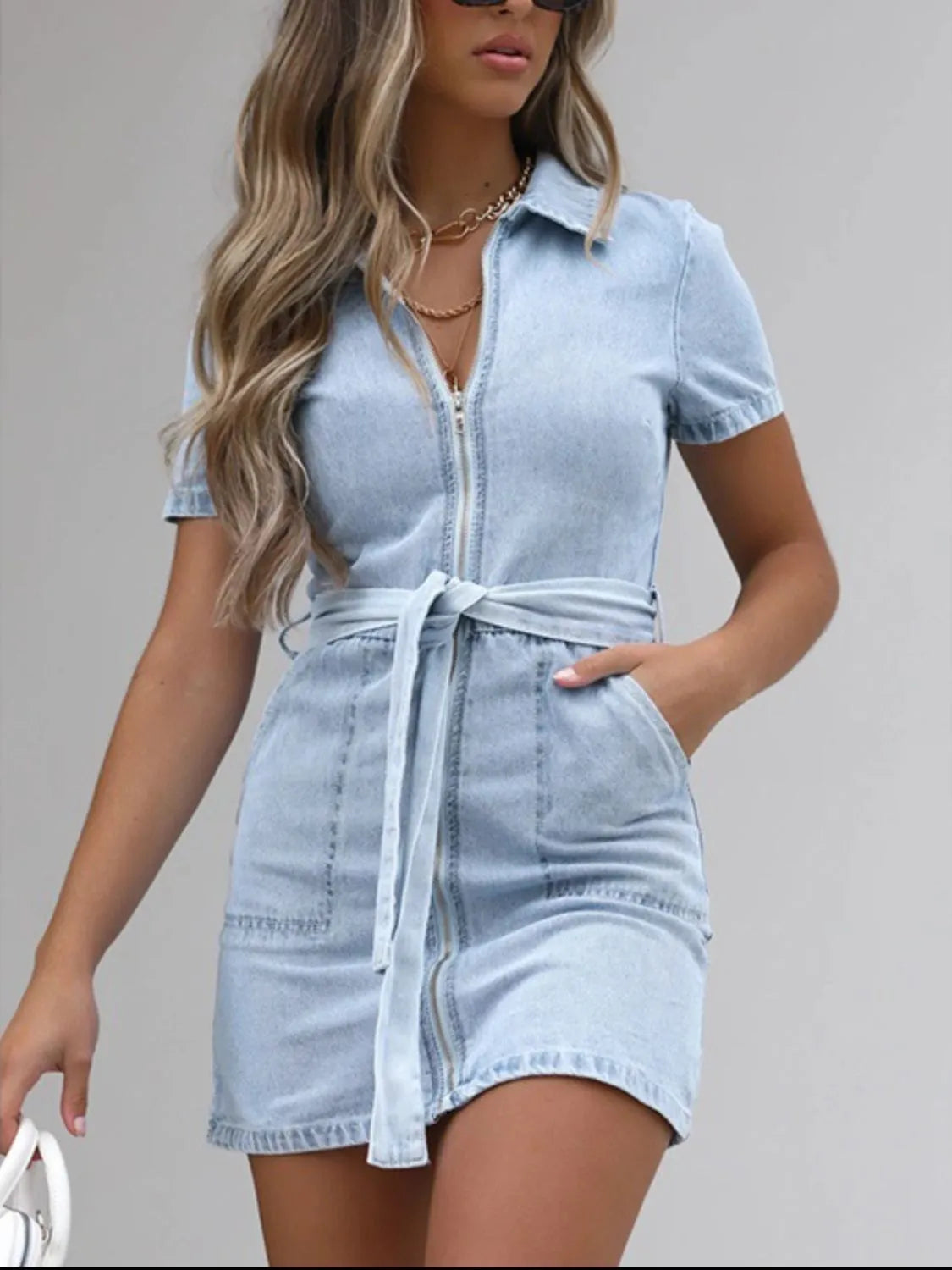Plus size denim dress with short sleeves and full zip front by Plush Fashion Hub, shown in a casual style.