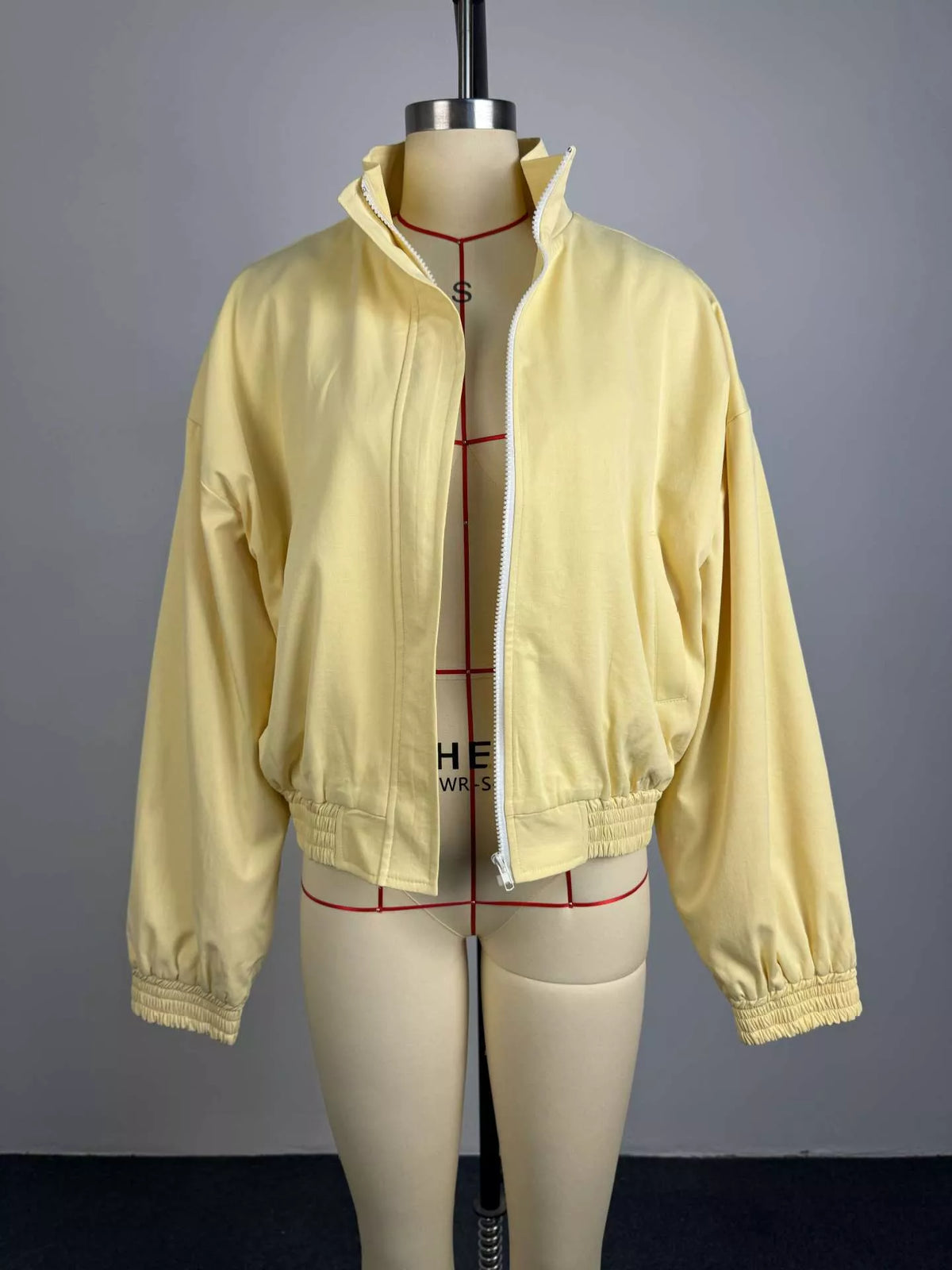 Women's oversized bomber jacket with zip-up front, stylish and trendy, featuring a relaxed fit and modern design.