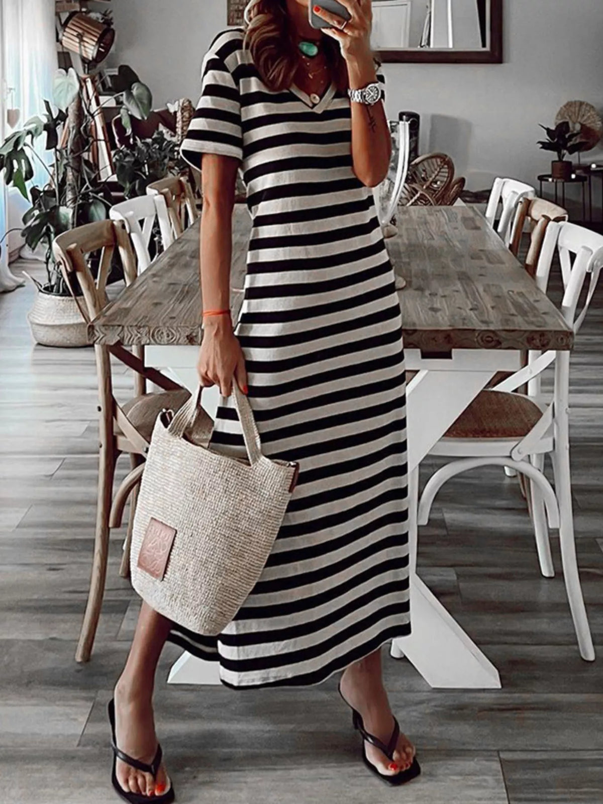 Plus size striped V-neck midi dress with side slit by Trendsi, featuring a stylish full-length design and comfortable fit.