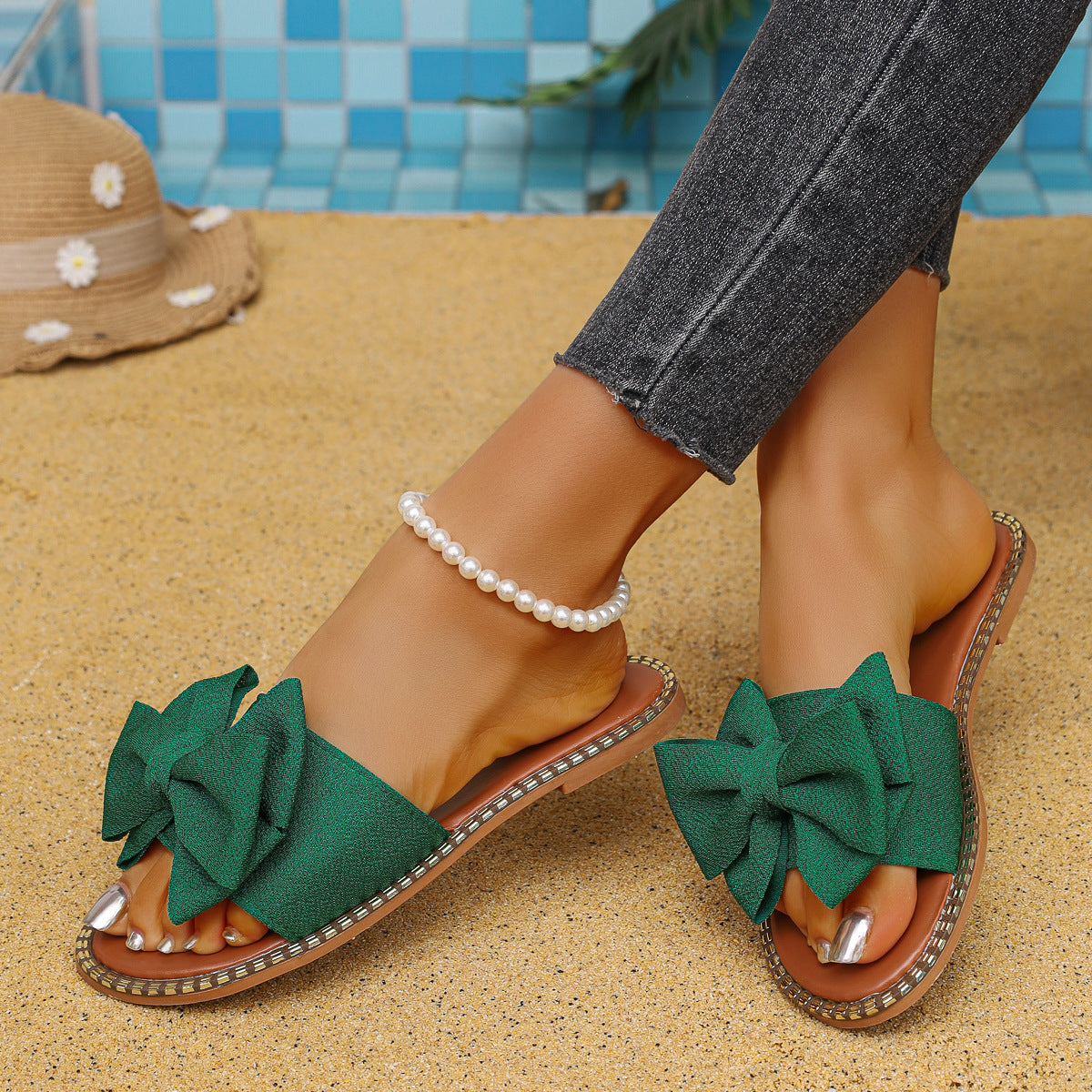 Plush Fashion Hub bowknot embellished flat sandals with open toe design and ankle strap, perfect for casual summer wear.