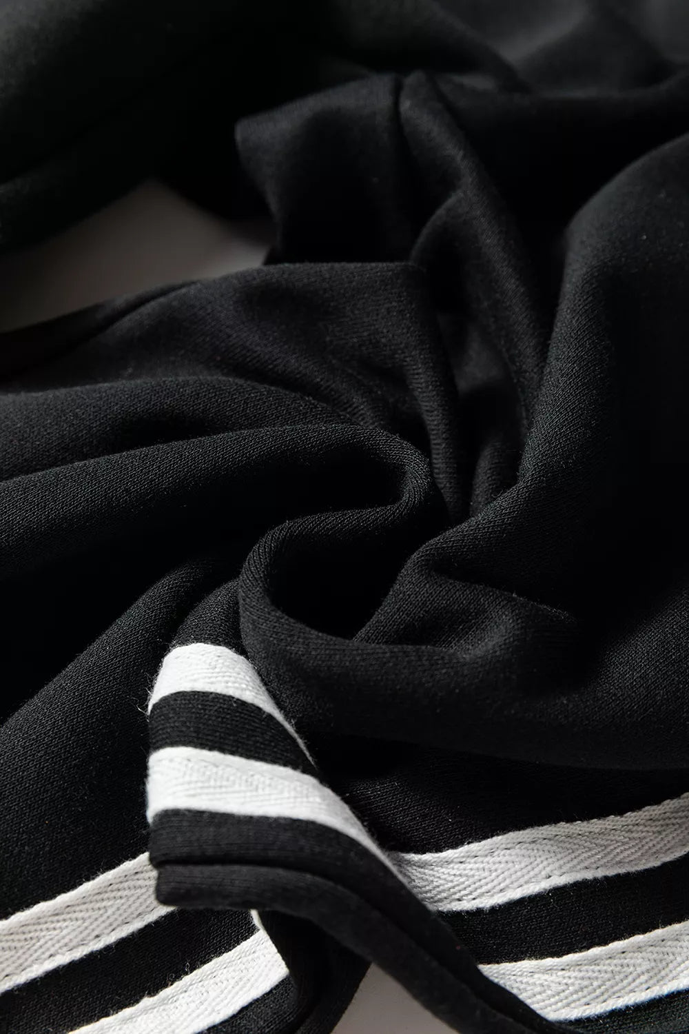 Trendsi striped detail crewneck pullover and elastic sweatpants 2-piece outfit set displayed on a hanger.