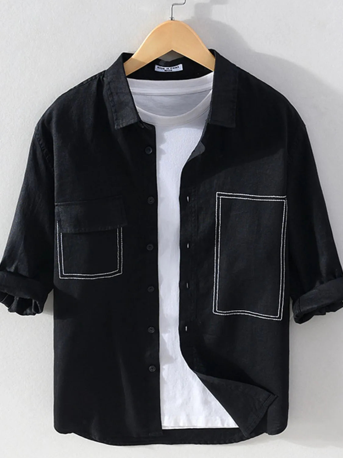 Men's plus size button-up shirt with chest pocket, casual style, in a soft fabric, featuring a classic collar and long sleeves.