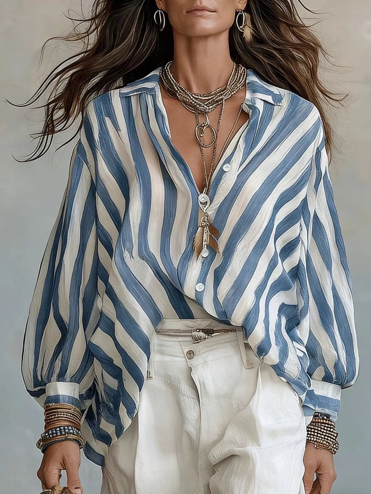 Women’s striped loose fit shirt by Trendsi, featuring a casual relaxed style with vertical stripes and a comfortable fit.