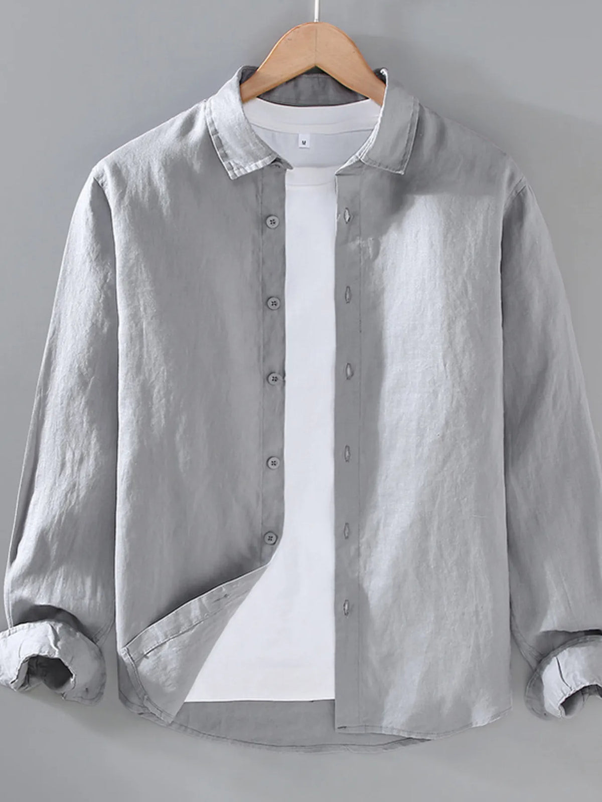 Plus size men's long sleeve button-up shirt by Plush Fashion Hub, shown in a casual fit with collar and button details.