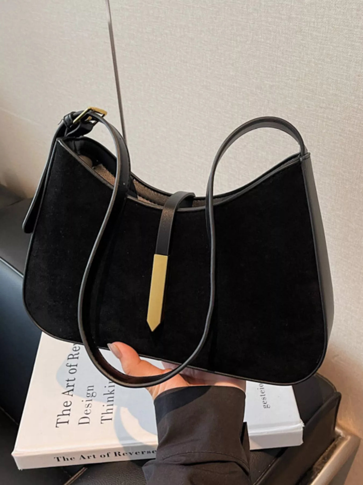 Adjustable strap shoulder bag from Plush Fashion Hub showing a sleek, stylish bag with a comfortable shoulder strap and minimalist design.