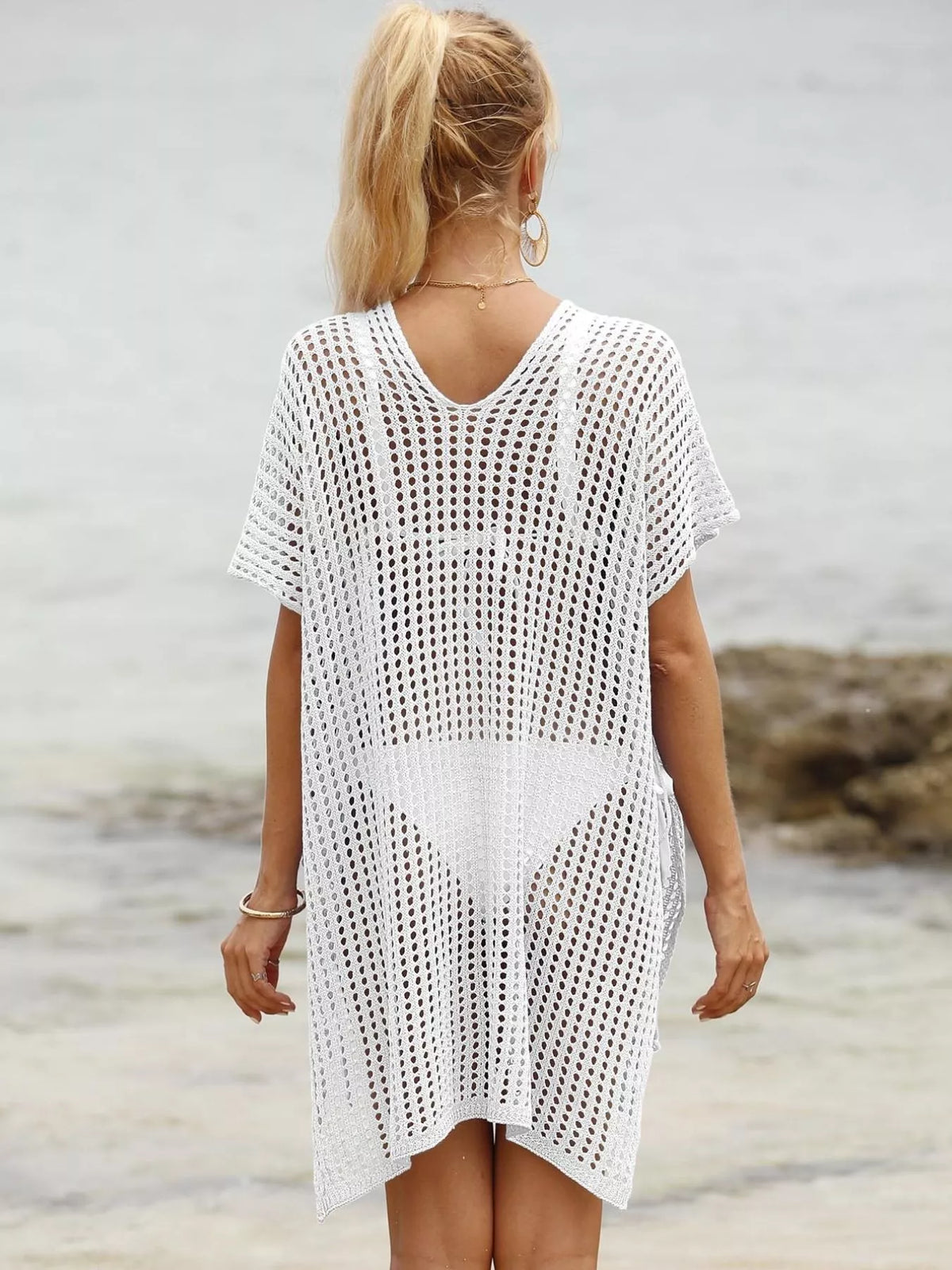 Openwork V-neck slit cover-up by Plush Fashion Hub, lightweight beach cover-up with stylish openwork design and V-neck.