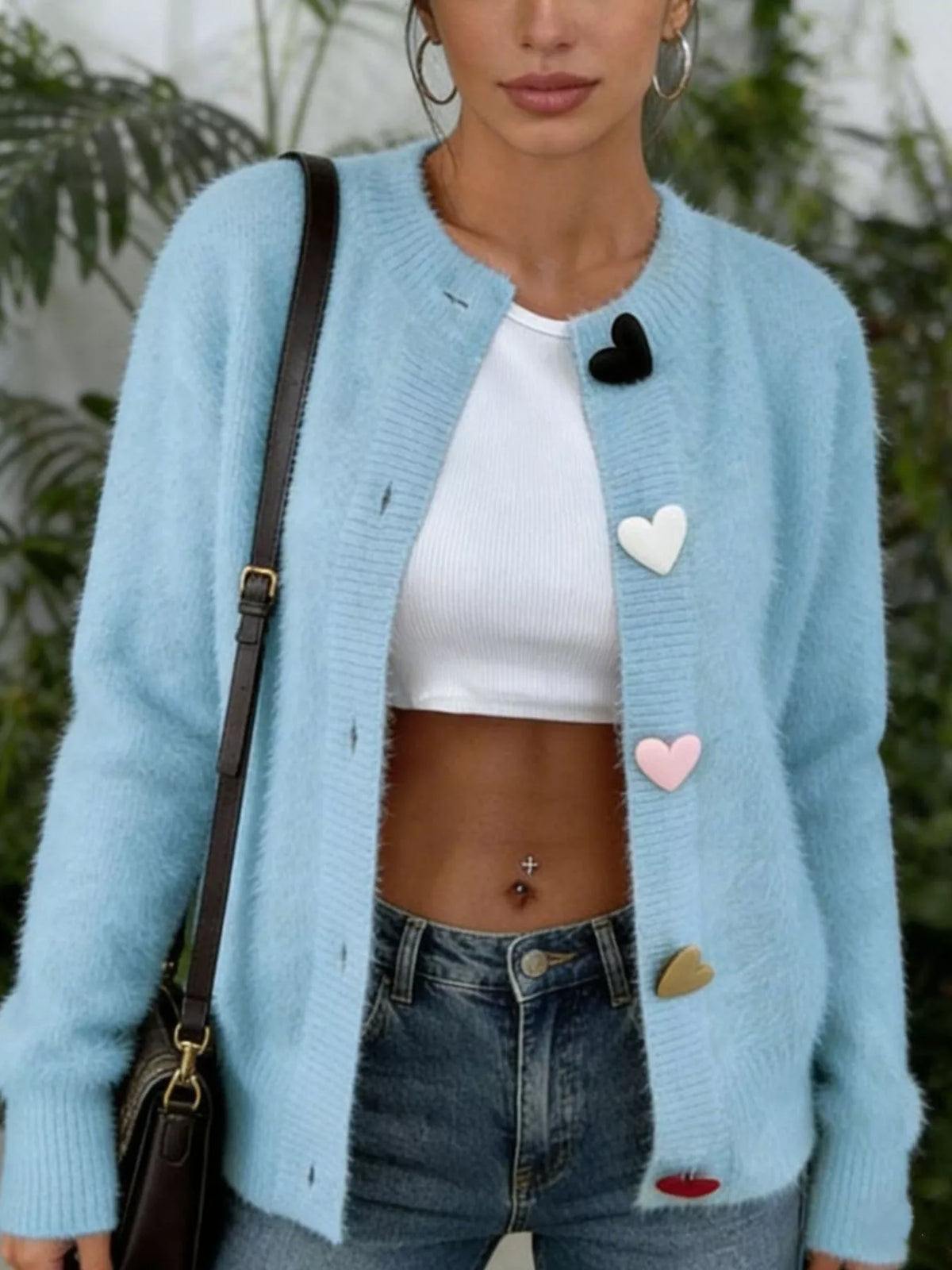 Plus size long sleeve heart button cardigan by Trendsi, knitted knitwear in full size with a cozy, stylish design.
