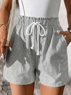 Women's striped elastic waist drawstring shorts by Trendsi, casual summer beachwear bottoms with a relaxed fit and breathable fabric.