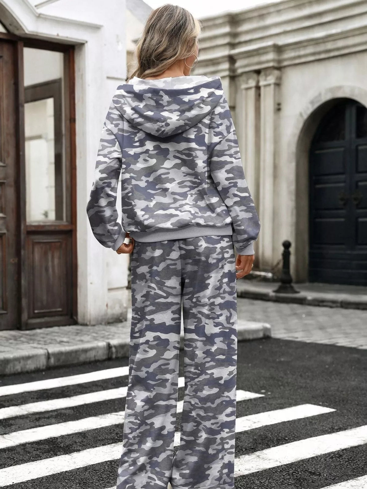 Printed long sleeve hoodie and pants set by Trendsi, featuring a stylish design, comfortable fit, and coordinated loungewear look.
