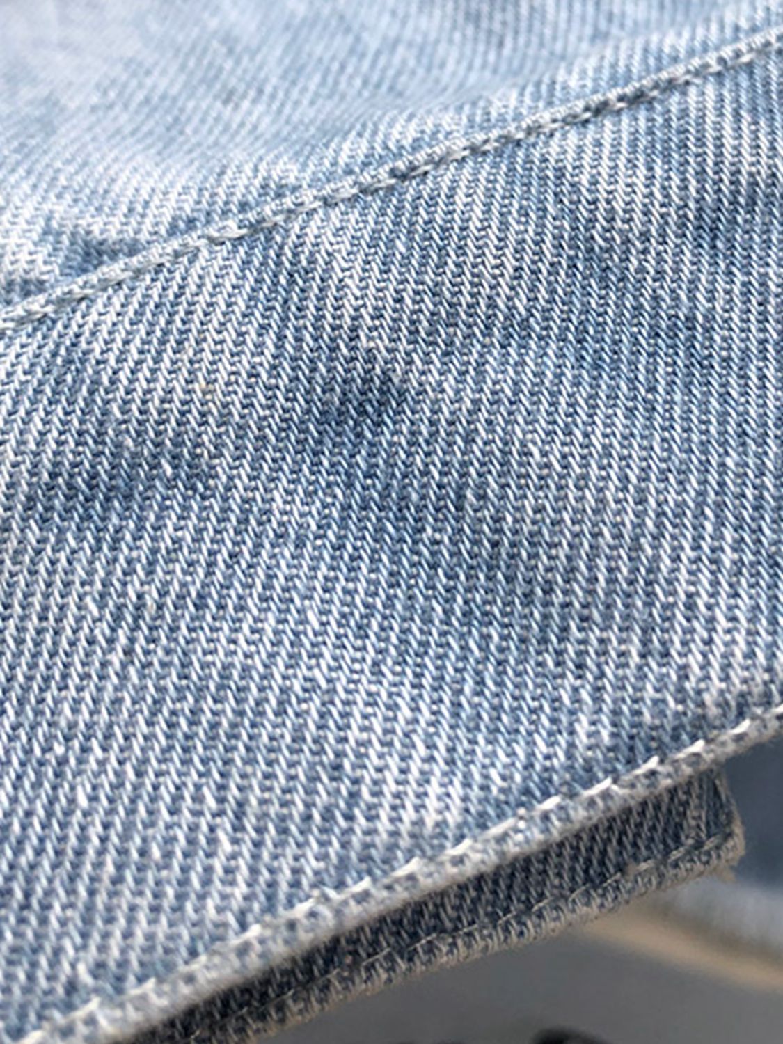 Raw hem collared neck long sleeve denim jacket by Plush Fashion Hub, shown with classic blue denim and button closure.