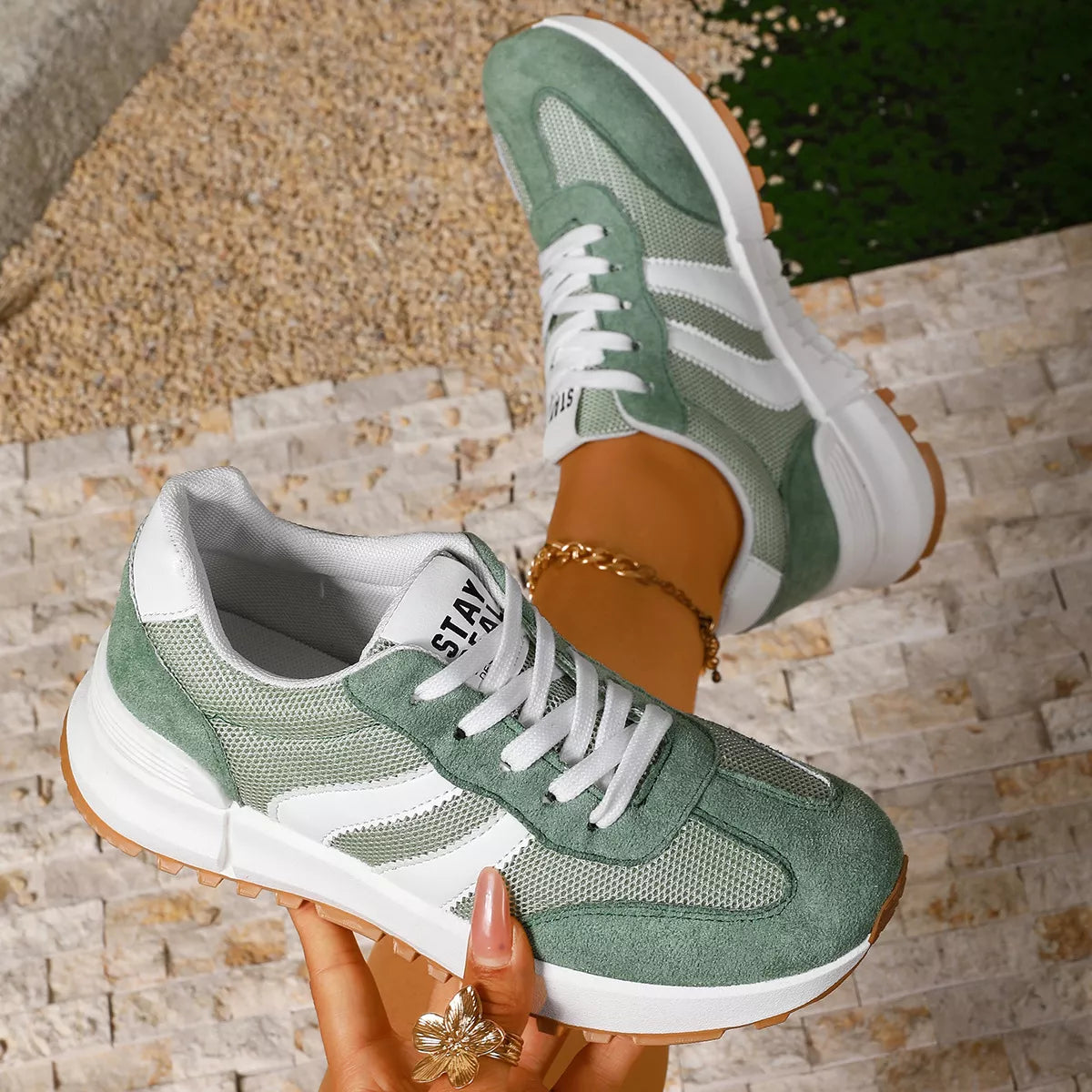 Women's round toe lace-up sneakers by Trendsi featuring classic design and comfortable fit, shown in a stylish side view.