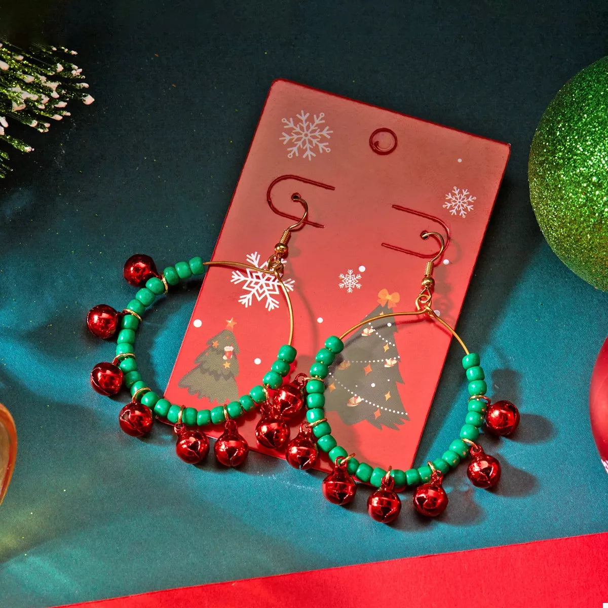 Christmas beaded hoop earrings with jingle bells, festive jewelry from Plush Fashion Hub, featuring colorful beads and holiday-themed accents.