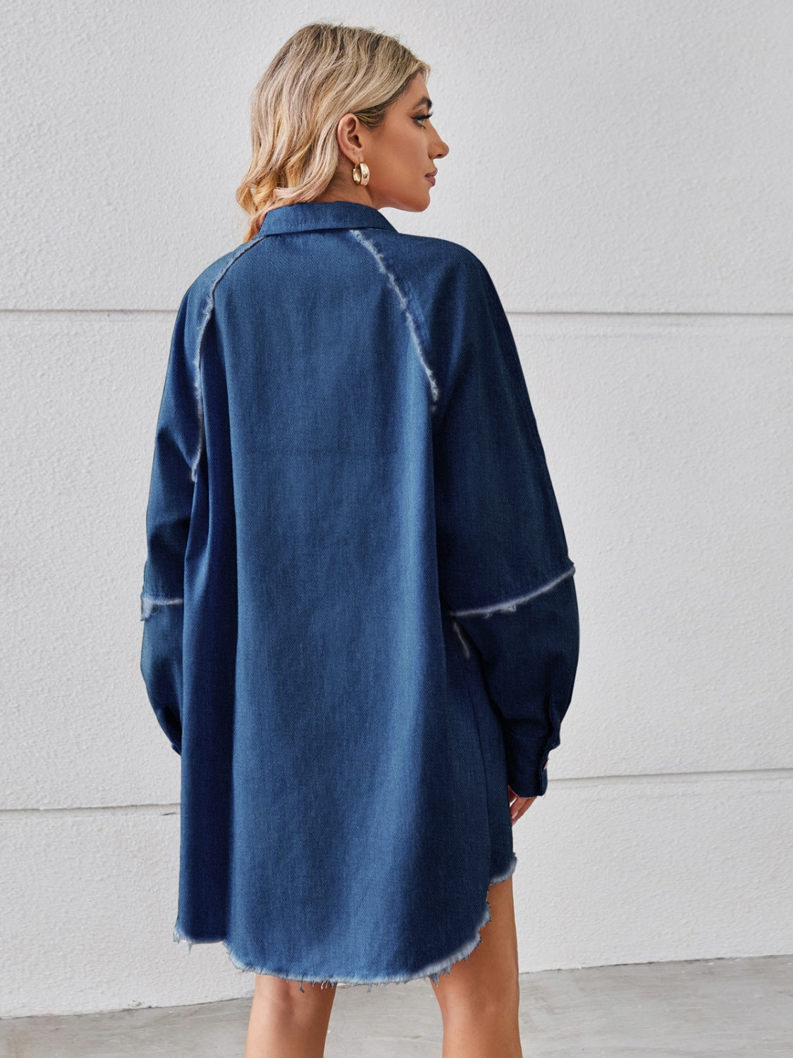 Raw hem button-up denim dress by Plush Fashion Hub featuring long sleeves, front buttons, and a casual, stylish fit.