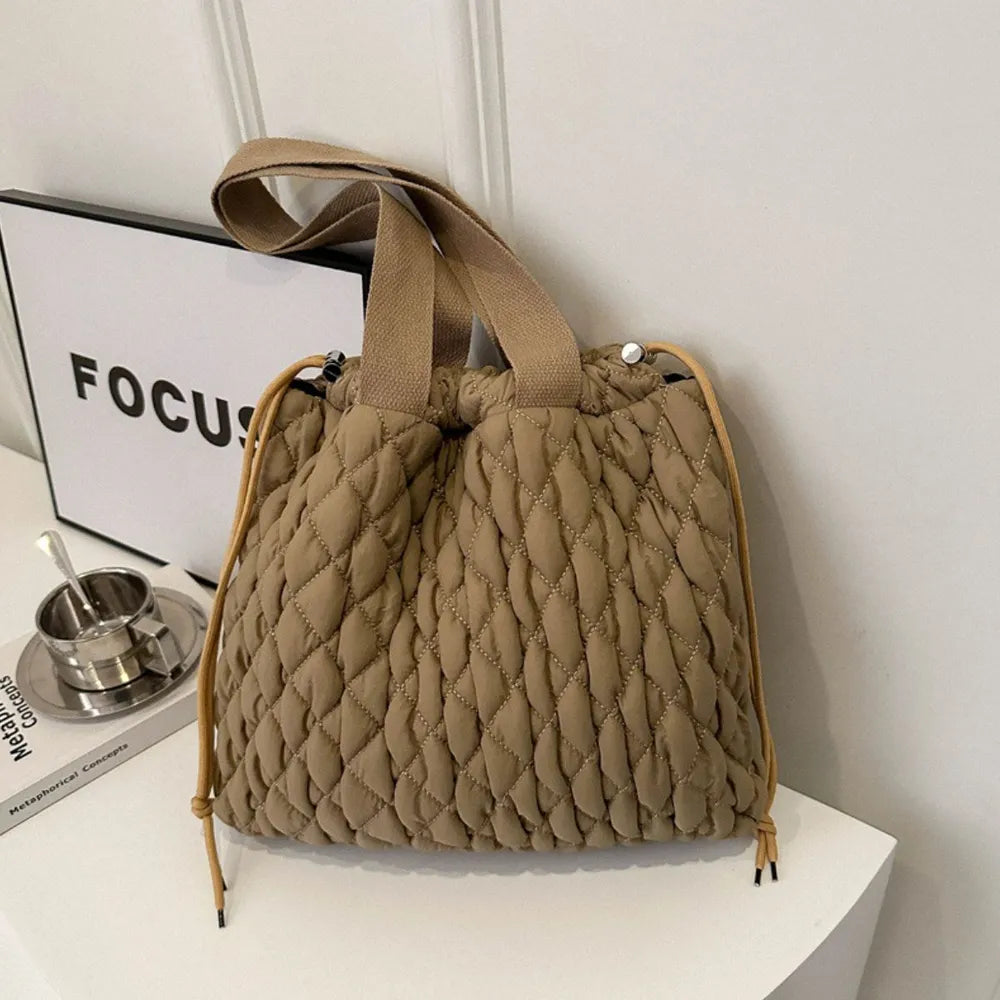 Plush Fashion Hub plush tote bag with bubble texture and drawstring closure, stylish and soft fabric for casual use.
