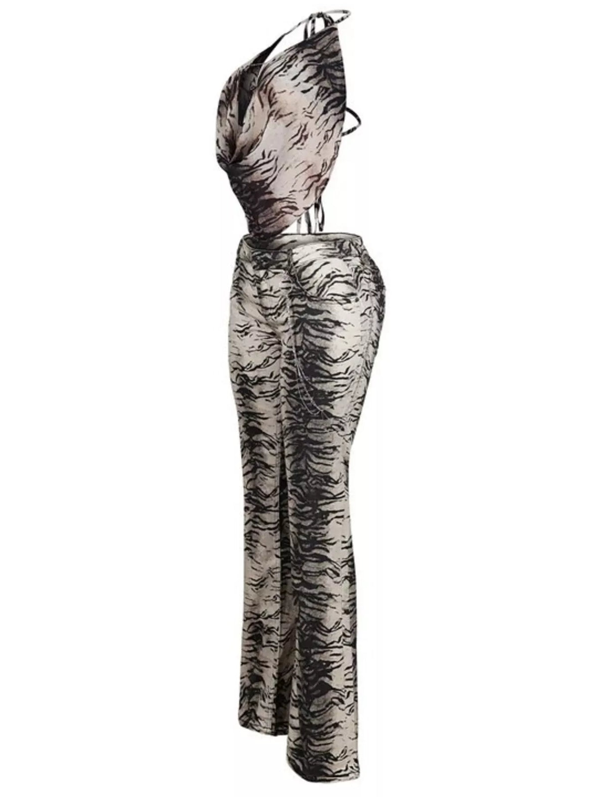 Women's animal print sleeveless top and pants set by Trendsi, featuring a stylish, coordinated outfit with bold animal print fabric.
