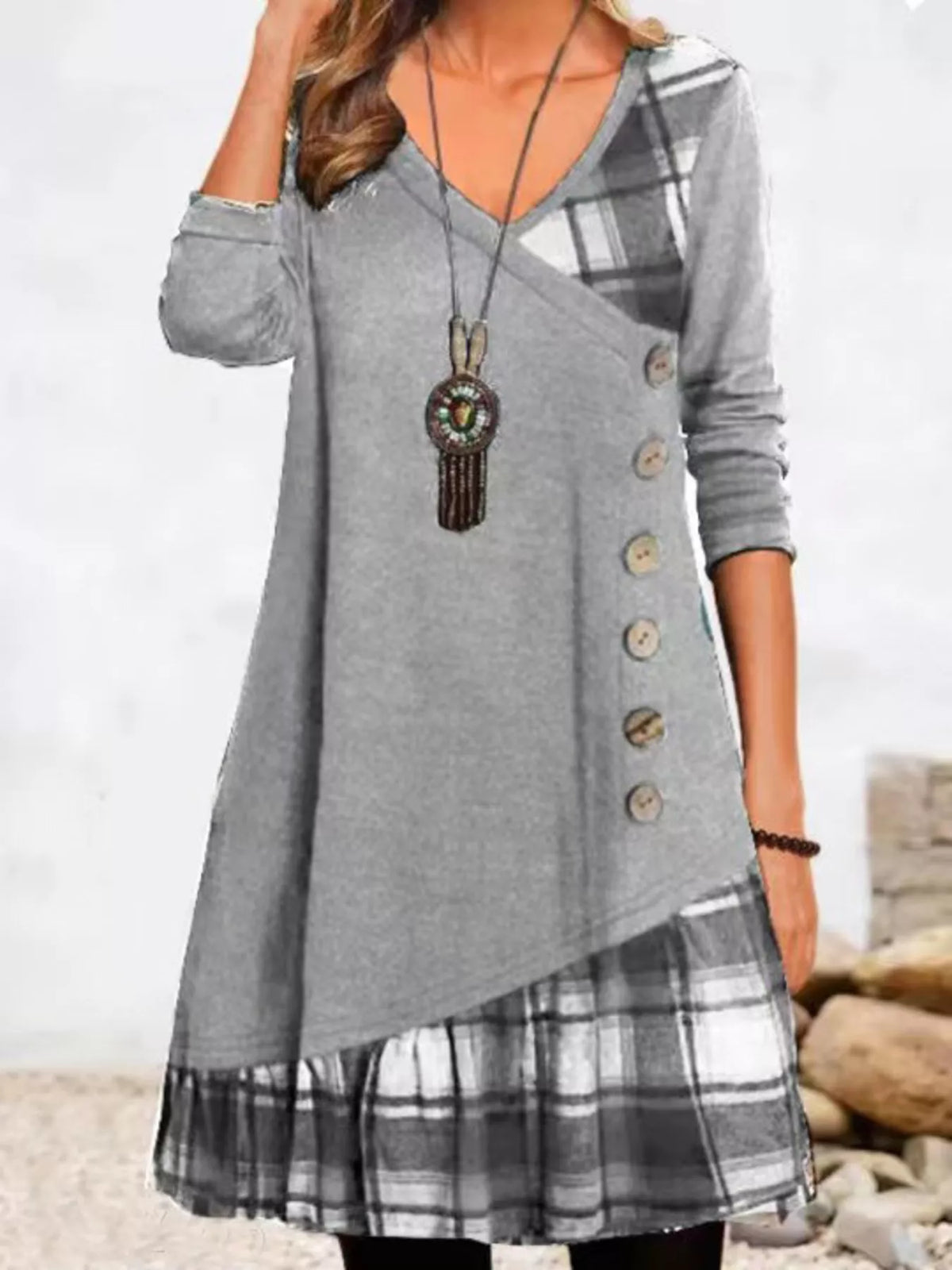 Plus size asymmetrical plaid patchwork long sleeve dress by Trendsi, featuring bold pattern and stylish design.