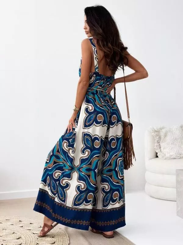Printed spaghetti strap wide-leg jumpsuit by Plush Fashion Hub featuring a stylish design and flowy wide-leg silhouette.
