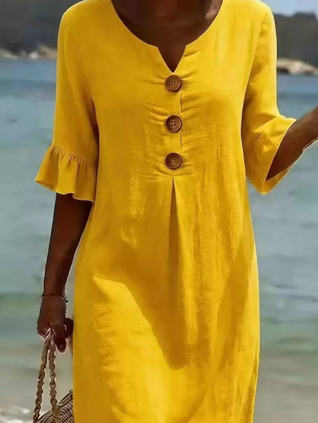 Plus size midi dress with button decor and ruffle sleeves, featuring a full-size fit from Trendsi.